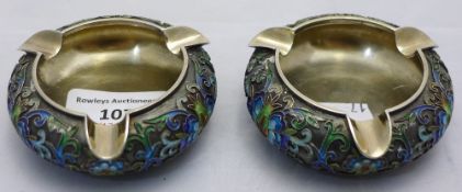 A pair of silver enamel ashtrays