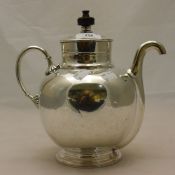 A silver plated self-pour teapot,