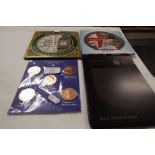 A collection of mint and unused English coins in presentation packs