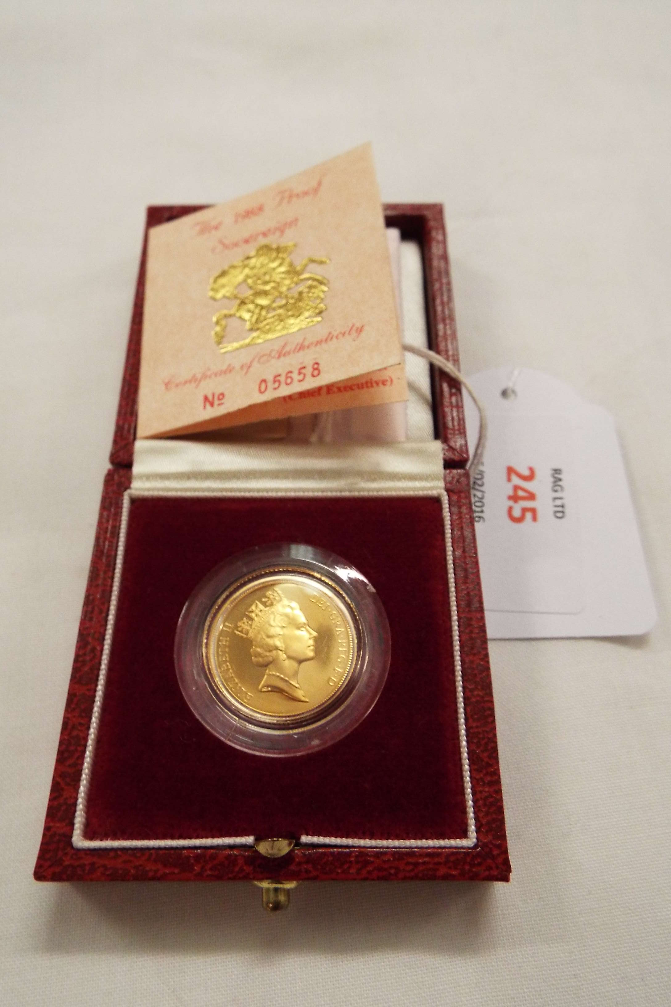 A 1988 gold proof sovereign in box with original receipt from Harrods