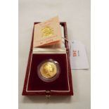 A 1988 gold proof sovereign in box with original receipt from Harrods
