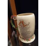 A Fieldings Crown Devon 'Daisy Bell' jug with embossed cycling theme and verse