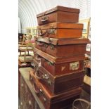 A group of vintage leather suitcases