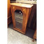 A 19thC walnut and satinwood inlaid music cabinet with 3/4 brass gallery the arched glazed door