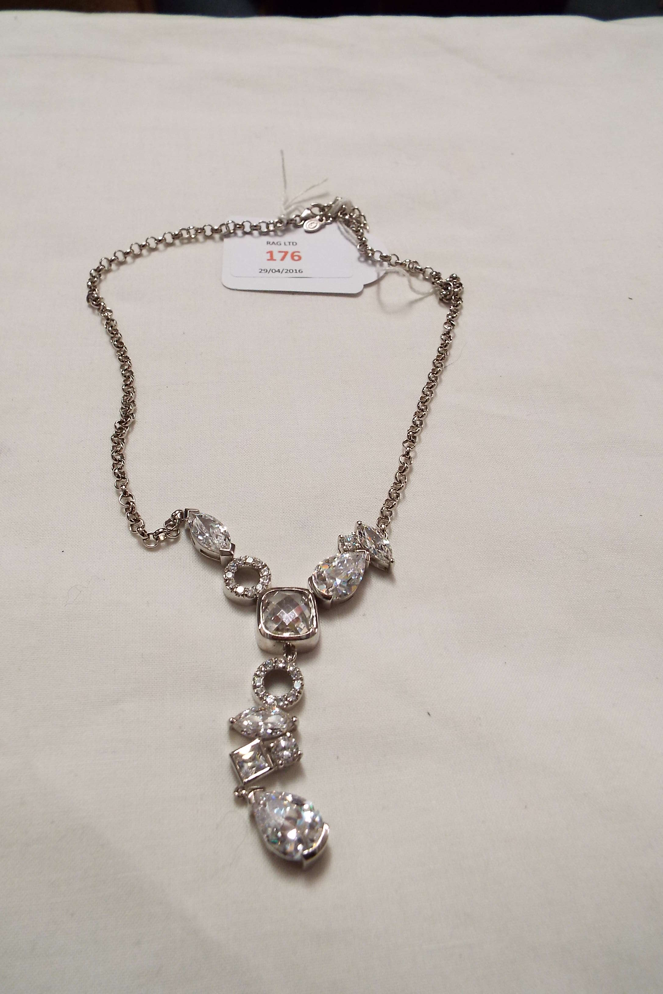 A silver belcher chain with contemporary clear stone lavalier