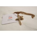 A 9ct gold belcher chain with 9ct gold cross pendant set with clear stones