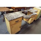 A 1950's painted steel and chrome beauty salon table with shaped marble top over twin pedestals