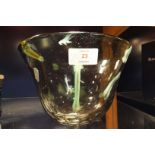 A Monart style art glass bowl decorated with swirls of yellow,