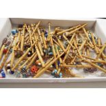 A large selection of lace making bobbins