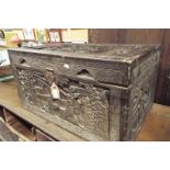 An early carved Oriental box having pictorial scene to all panels