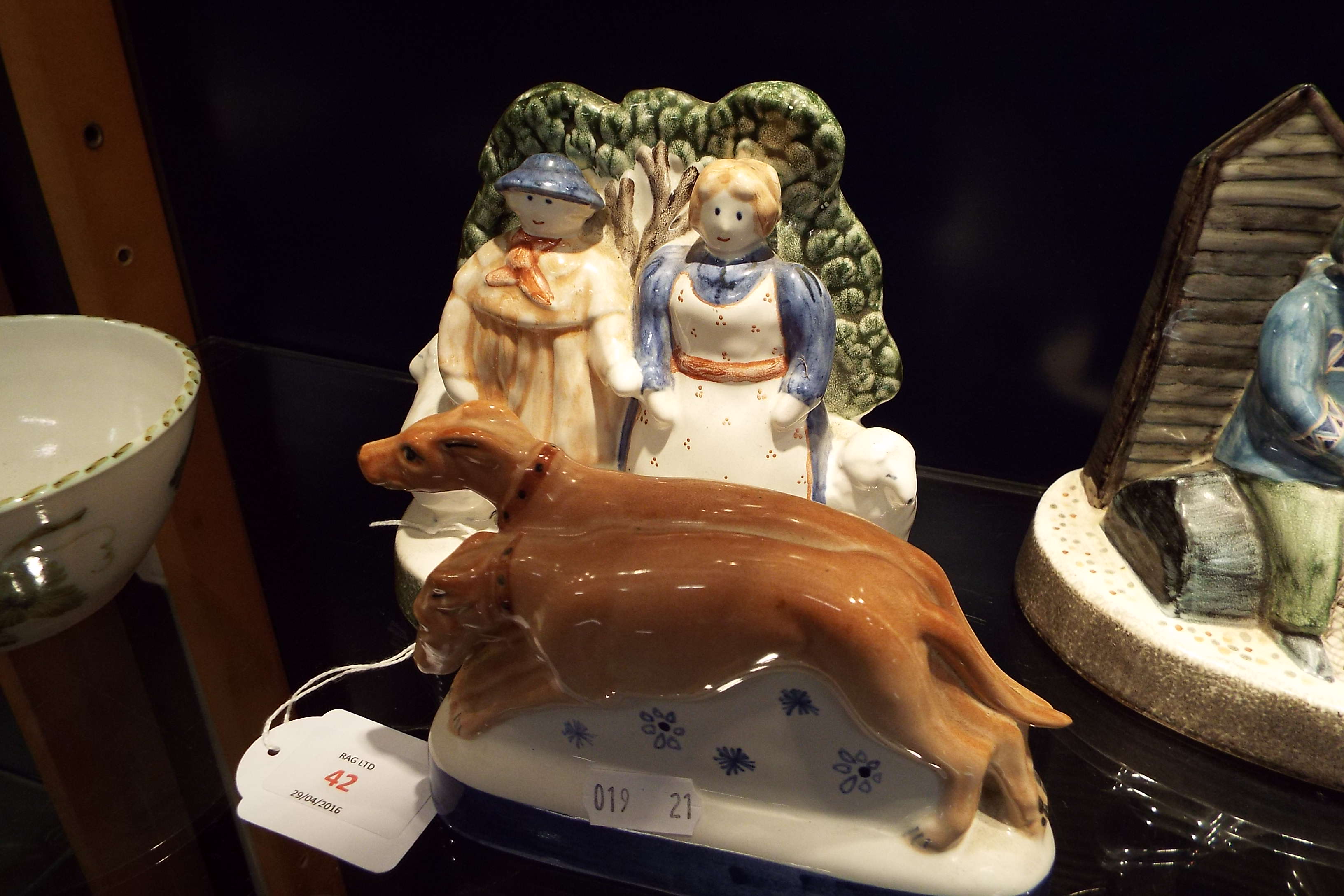 A Rye Pottery figure 'Farmer and Wife' with a pair of greyhounds