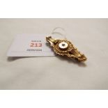 A Victorian 9ct gold Etruscan revival brooch with locket back