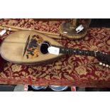 A rosewood cased mandolin for restoration