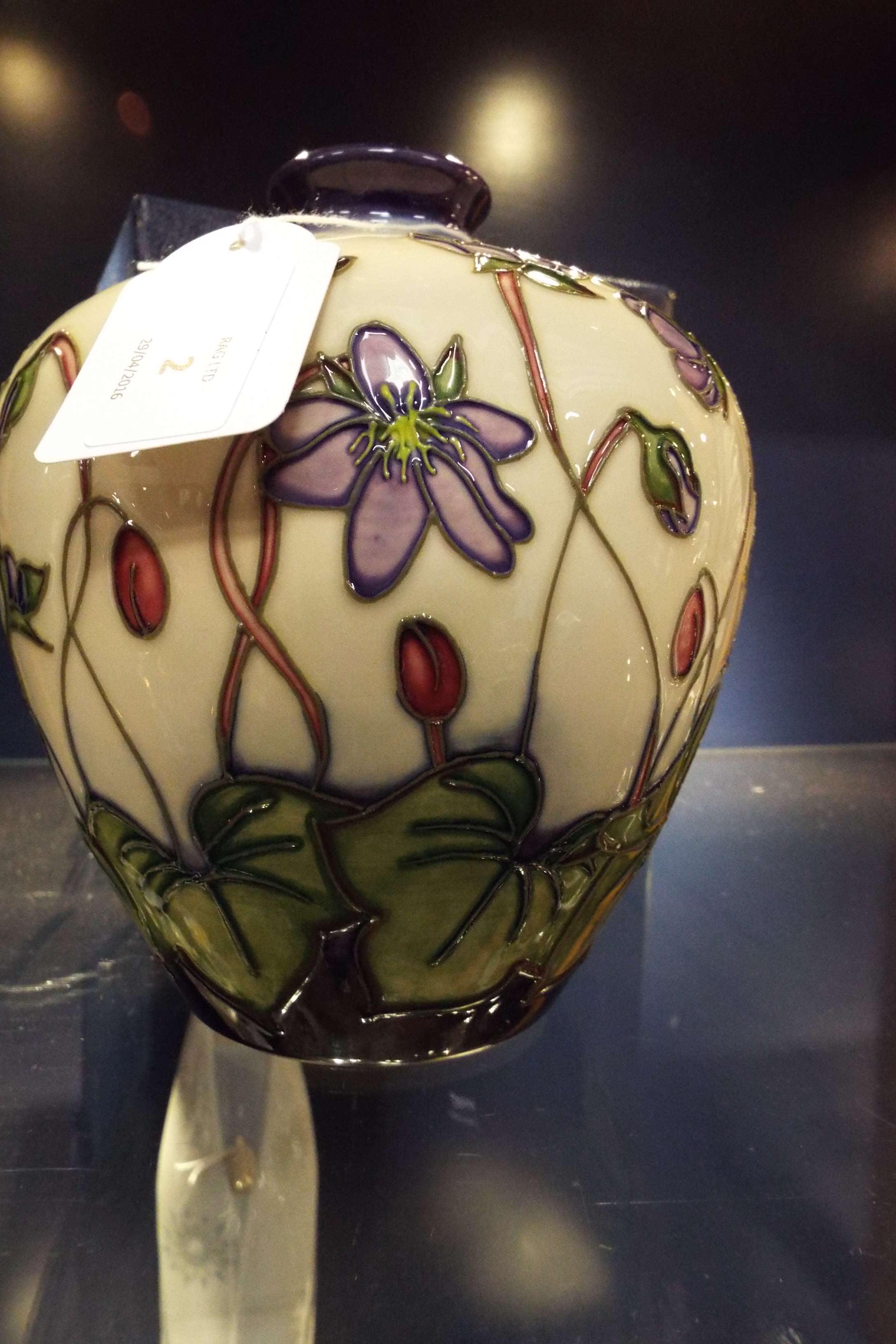 A modern Moorcroft vase of ovoid form with blue floral decoration, signed to the base,