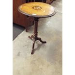 A mahogany inlaid circular top side table resting on turned pillar and tri-form base A/F