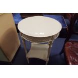 A round occasional table painted in the French style