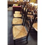 Two pair of Victorian elm ladder back side chairs with rush upholstered seats