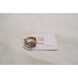 A 9ct gold ring set with diamonds and clear stones,