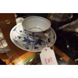 A 19thC Meissen blue and white Chinese style cup with associated saucer