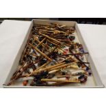 A large selection of lace making bobbins