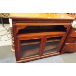 A Victorian walnut free standing bookcase the moulded top over a ring turned friezed and aperture