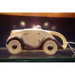A ceramic Sadler design 'Racing Car' teapot with highlights OKT42