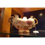 A twin handled china cream ground vase having hand-painted 'Dahlia's',