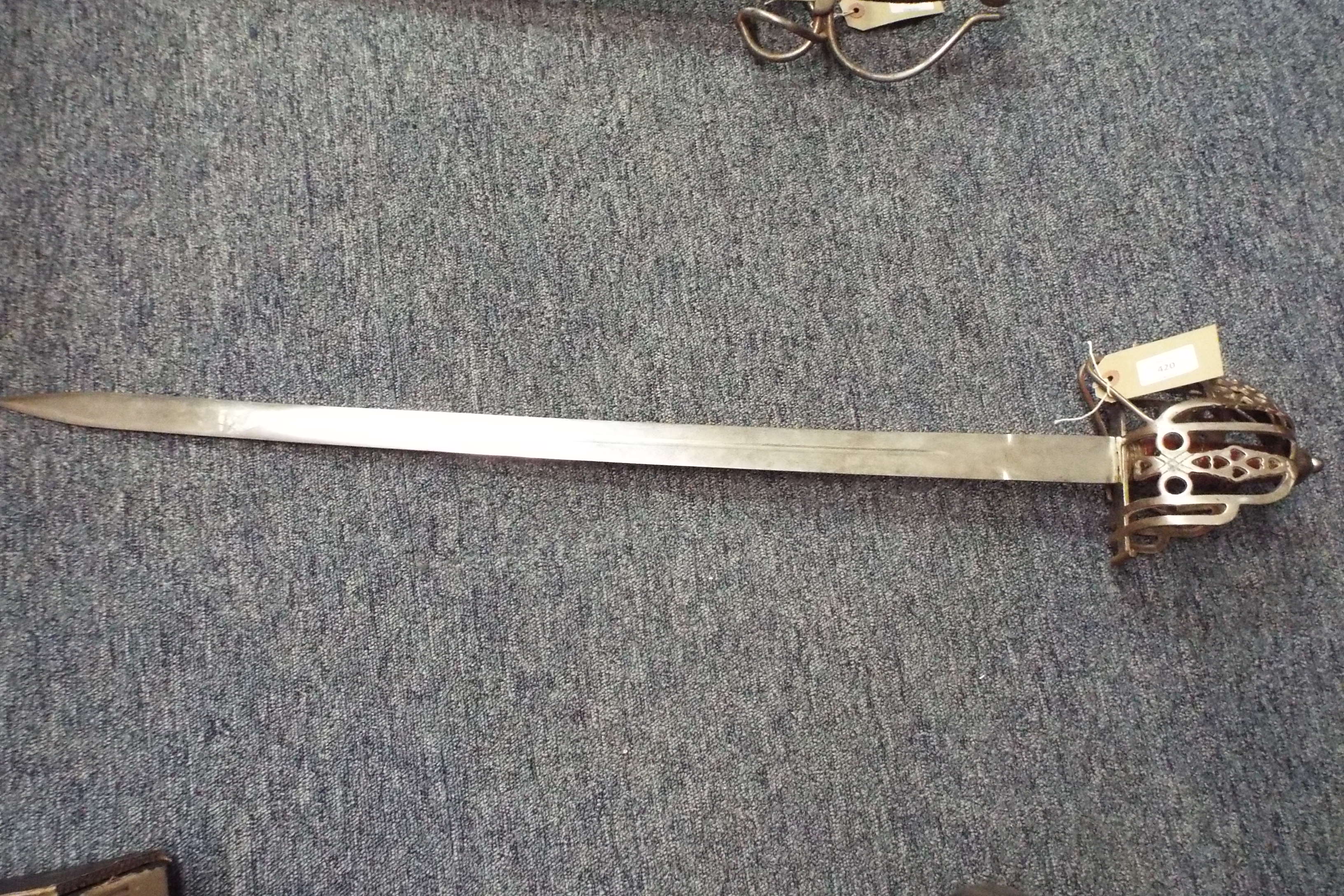 A Scottish officers dress sword having pierced basket hilt,