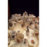 A large selection of crested-ware to include shoes, barrel,