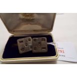 A pair of square silver cufflinks with hallmark decoration dated Birmingham 1977