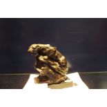 After John Macallan Swan resin figure of a lioness crouching on a rock raised on a slate back