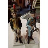 A pair of Continental Naples figurines of soldiers in uniform marks to base