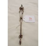 A Russian silver ornamental pointer having prancing lion finial applied to an ornate orb,