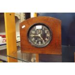 A USA Navy Ark 1-Deck clock having black dial with Arabic numerals housed in a mahogany case No