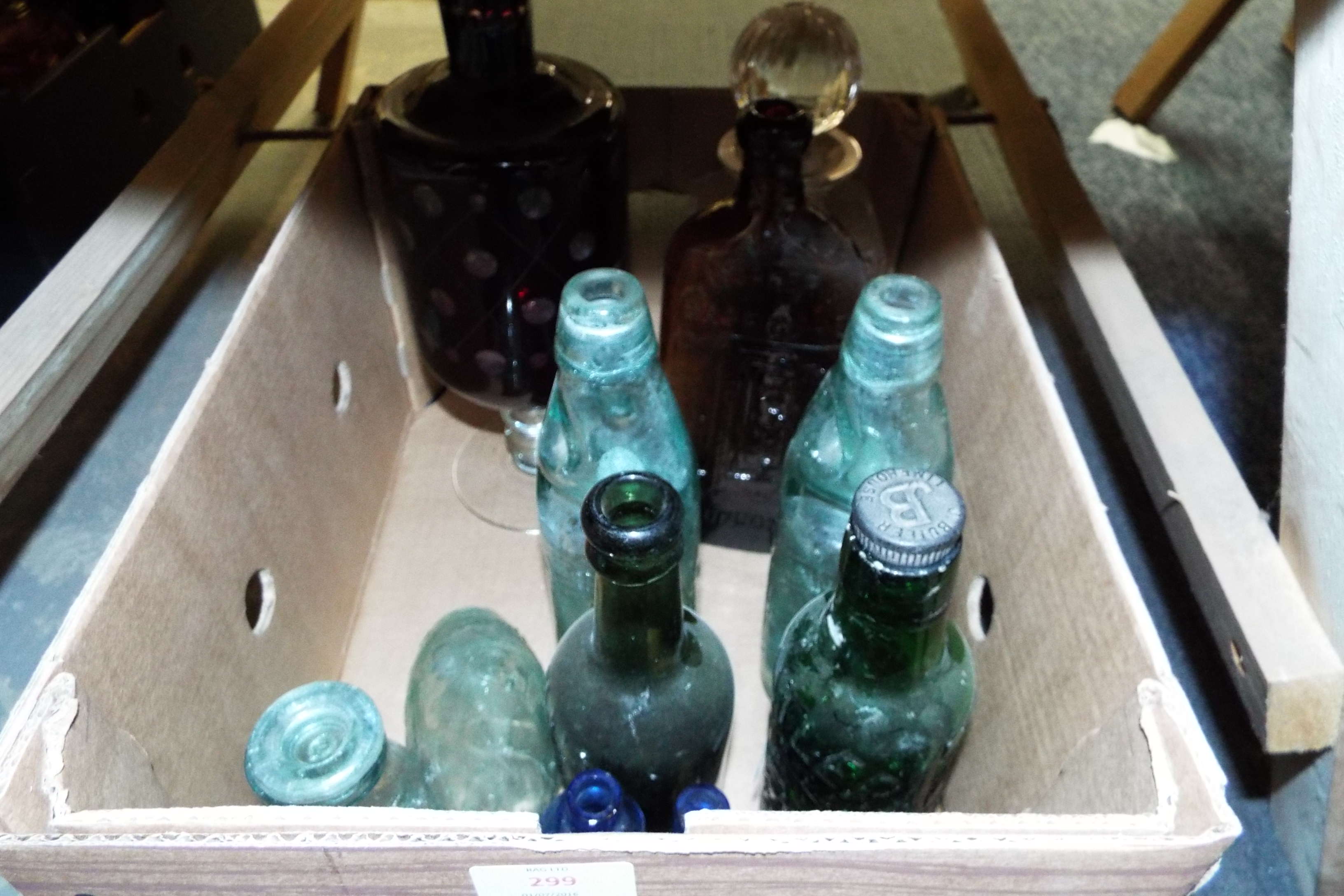 A crystal glass decanter and a selection of vintage bottles to include 'Warners Safecure',