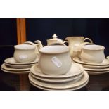 A six place Denby Linen tea set comprising cups and saucers, tea plates, covered sugar bowl,