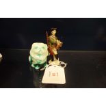A Royal Doulton Pekinese signed Noke and a Meissen figure of a hunter with tri-corn hat