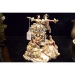 A Dresden figurine of a Regency couple dancing,