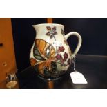 A Moorcroft 'Blackberries' pattern jug, heavily crazed,