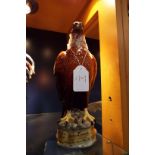 A Beswick golden eagle decanter containing Beneagles whisky Head loose from cork,