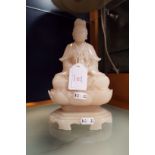 A carved alabaster Buddha