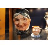 A Royal Doulton character jug 'Granny' and a miniature character jug 'Fat Boy'