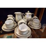 A six place Denby Linen tea set comprising cups and saucers, tea plates, covered sugar bowl,