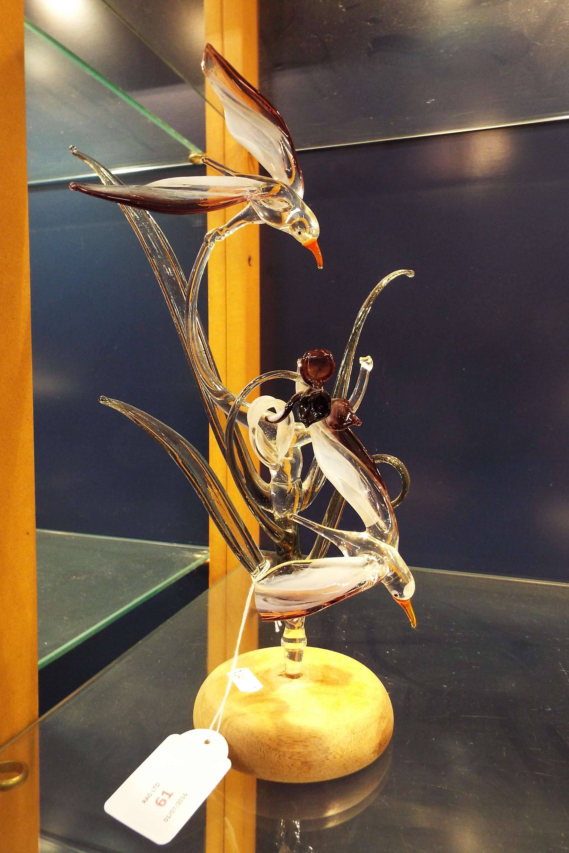 A Rod Beckhurst hand-sculptured glass bird array mounted on wooden base A/F