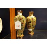 A pair of 19thC cloisonne vases of pumpkin form having yellow ground with ornate floral decoration