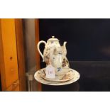 A 19thC oriental porcelain teapot, milk jug,