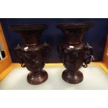 A pair of bronze Japanese vases having central panel with applied bird decoration,