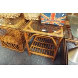 A bamboo and wicker glass topped coffee table with under tier as new