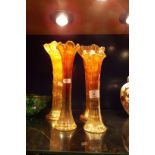 A pair of carnival glass flute vases and two others