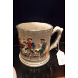 A Staffordshire pottery mug having drinking scene pattern and inner frog